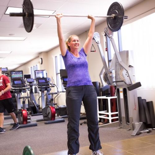 zumba teacher lifting weights